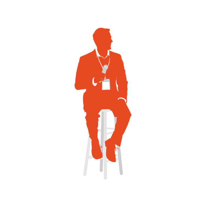 Male speaker seated with microphone